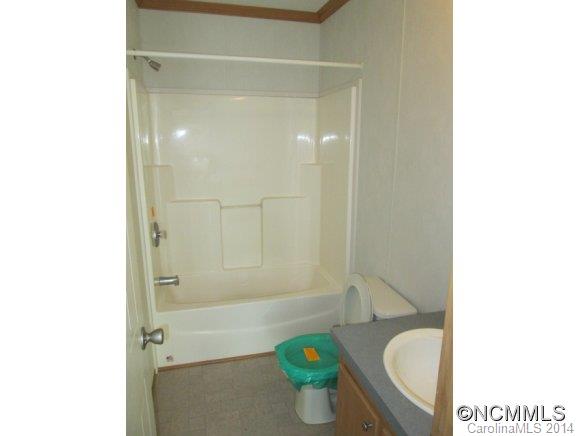 141 Prairie Cottage Road Clyde, NC 28721 - Photo 8 of 20 a bathroom with a sink and a bathtub