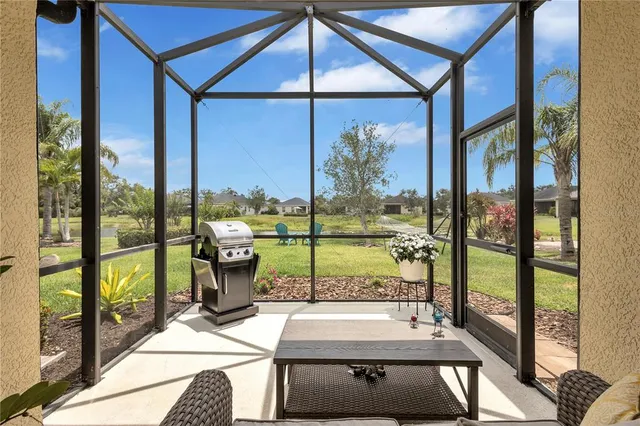a room with a large window and pool table