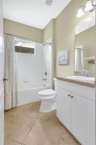 a bathroom with a toilet sink and a mirror