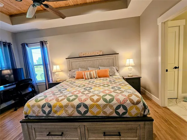 a bedroom with a bed and window