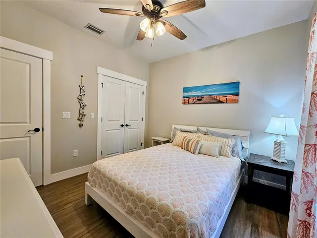 a bedroom with a bed and a walk in closet