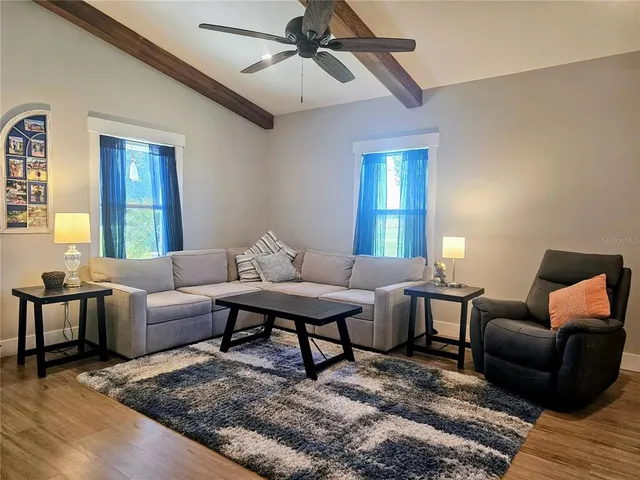 a living room with furniture and a window