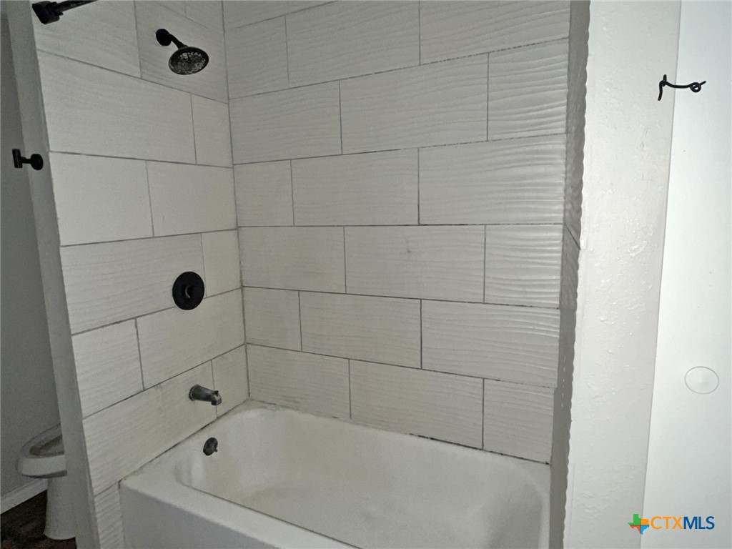 104 East Elms Road Killeen, TX 76542 - Photo 14 of 24 a bathroom with a shower