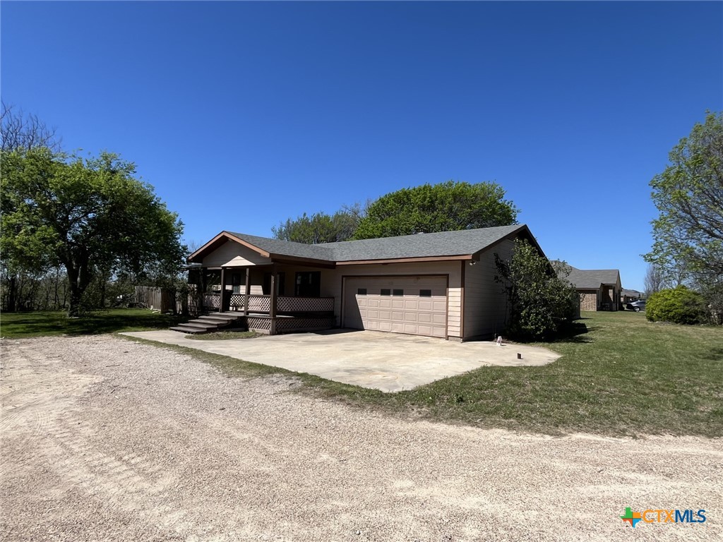 104 East Elms Road Killeen, TX 76542 - Photo 24 of 24 a front view of a house with a yard and garage