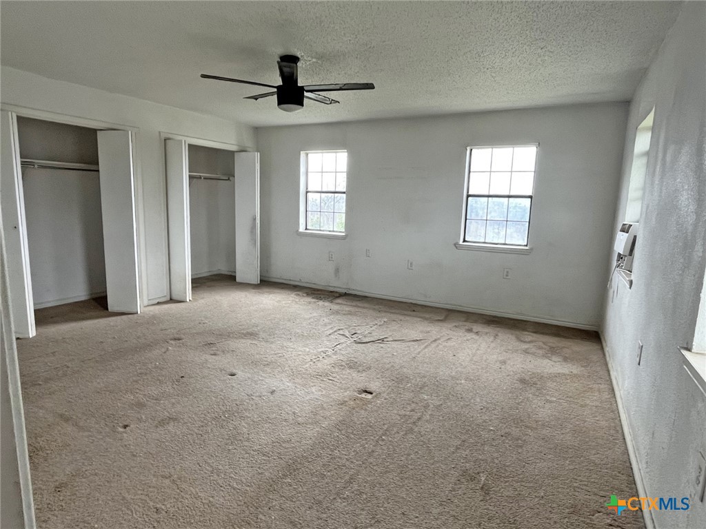 104 East Elms Road Killeen, TX 76542 - Photo 7 of 24 a view of a livingroom with a ceiling fan and window