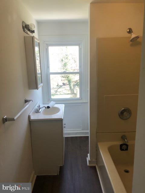 60 Walnut Street Salem, NJ 08079 - Photo 8 of 11 a bathroom with a tub sink and mirror