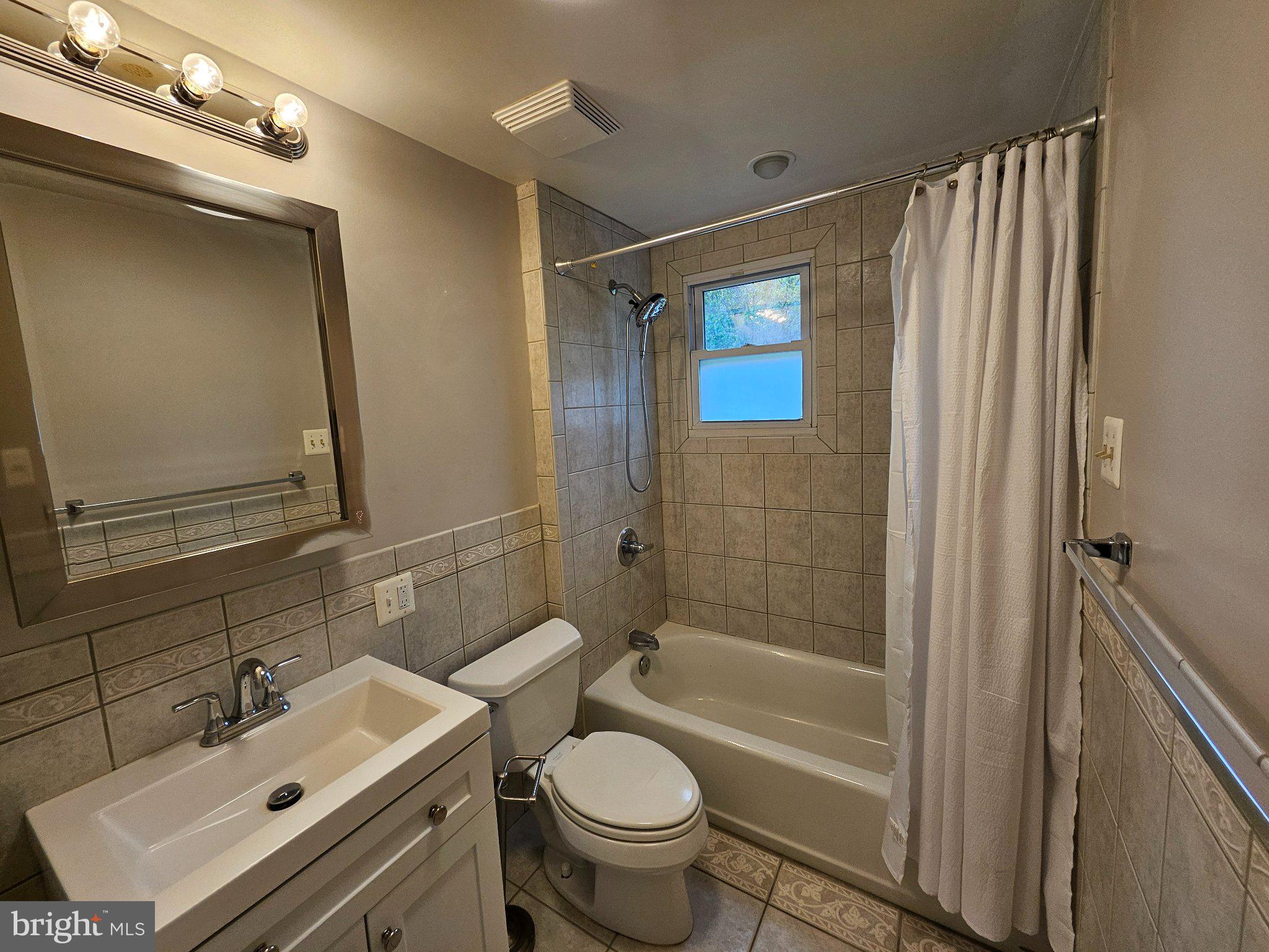 6 Arthur Road, Unit FRONT Rosemont, PA 19010 - Photo 10 of 24 Modern bathroom with elegant tiles.