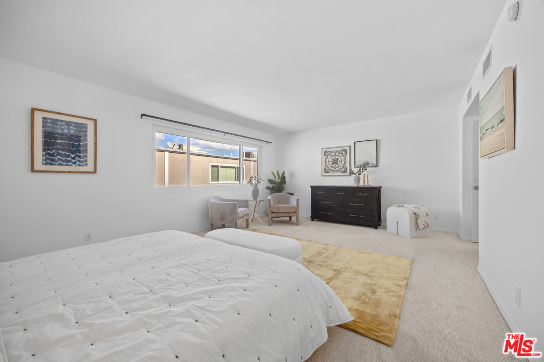 13065 Mindanao Way, Unit 3 Marina del Rey, CA 90292 - Photo 13 of 25 a bedroom with a bed and a couch
