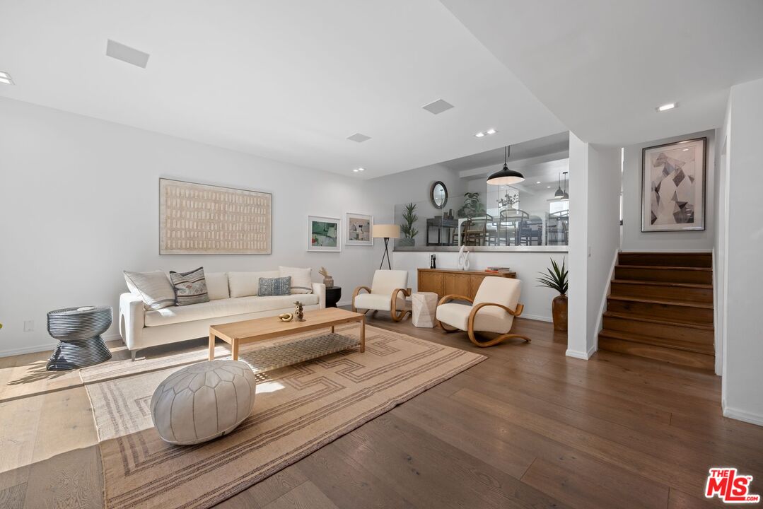 13065 Mindanao Way, Unit 3 Marina del Rey, CA 90292 - Photo 2 of 25 a living room with furniture and wooden floor