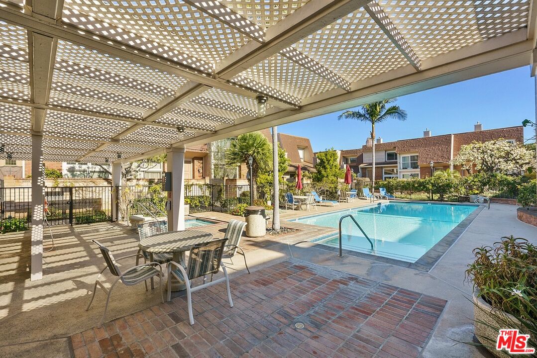 13065 Mindanao Way, Unit 3 Marina del Rey, CA 90292 - Photo 23 of 25 a view of a patio with a table and chairs