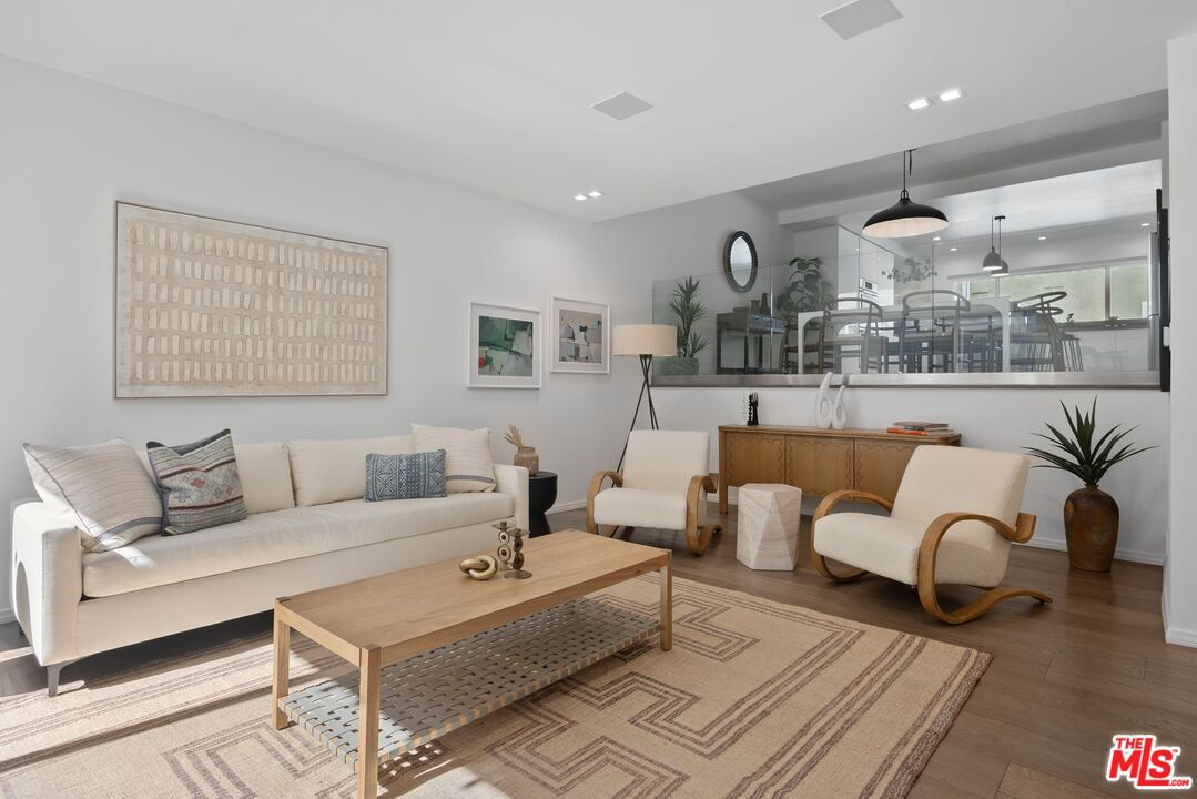 13065 Mindanao Way, Unit 3 Marina del Rey, CA 90292 - Photo 3 of 25 a living room with furniture and view of kitchen