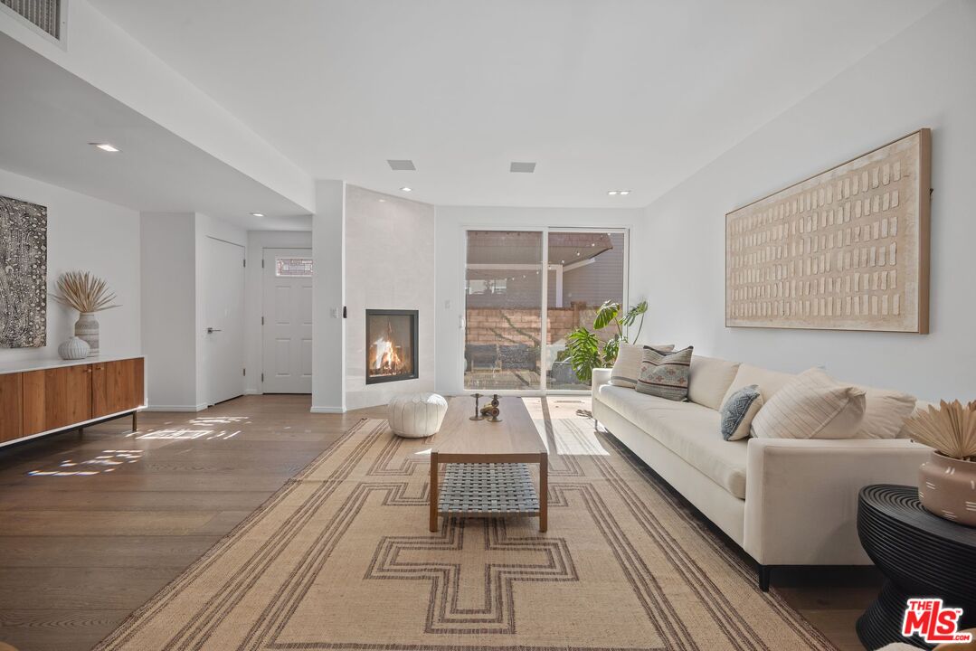 13065 Mindanao Way, Unit 3 Marina del Rey, CA 90292 - Photo 5 of 25 a living room with furniture and a large window