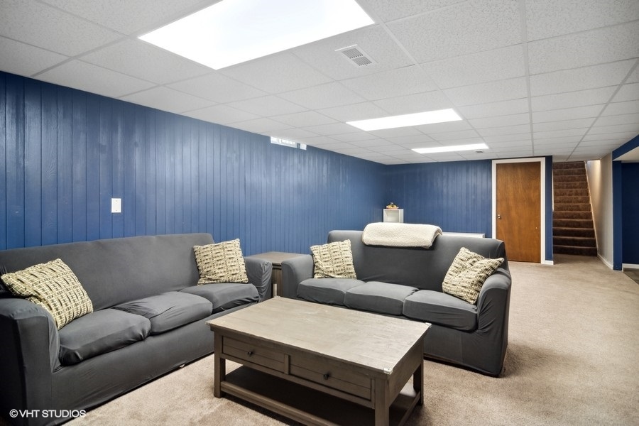 2110 Savannah Road Elgin, IL 60123 - Photo 15 of 17 a living room with furniture and a rug
