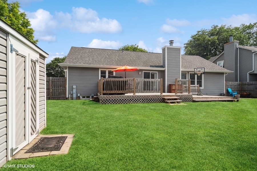 2110 Savannah Road Elgin, IL 60123 - Photo 17 of 17 a front view of a house with garden