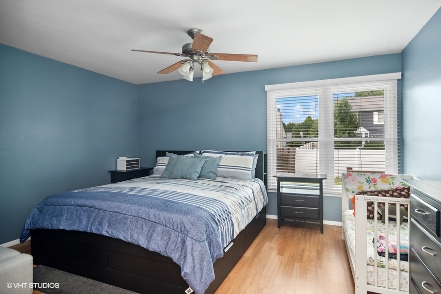 2110 Savannah Road Elgin, IL 60123 - Photo 9 of 17 a bedroom with a bed and a window