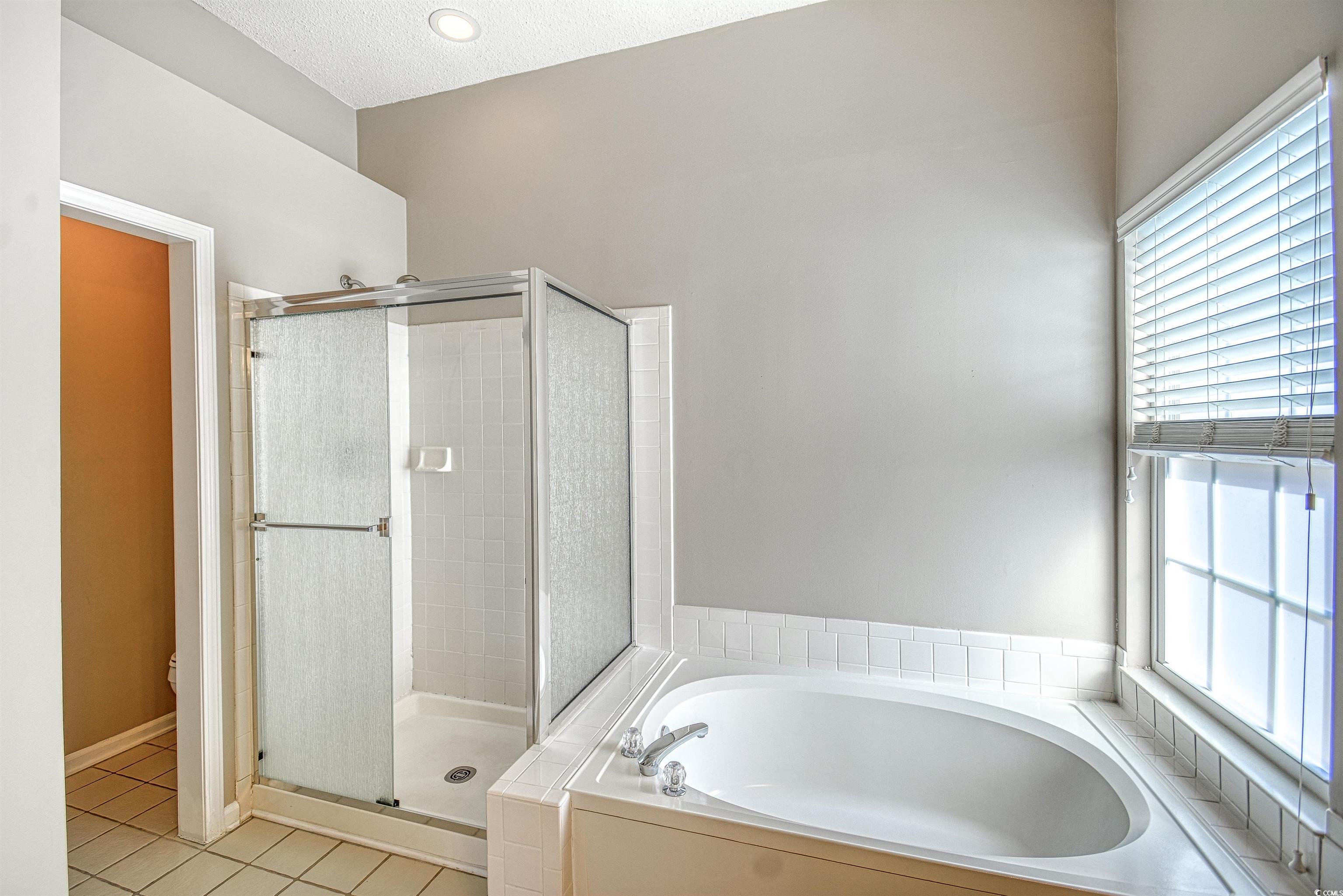 651 Bluebird Lane Murrells Inlet, SC 29576 - Photo 15 of 34 Bathroom featuring tile patterned flooring, a text