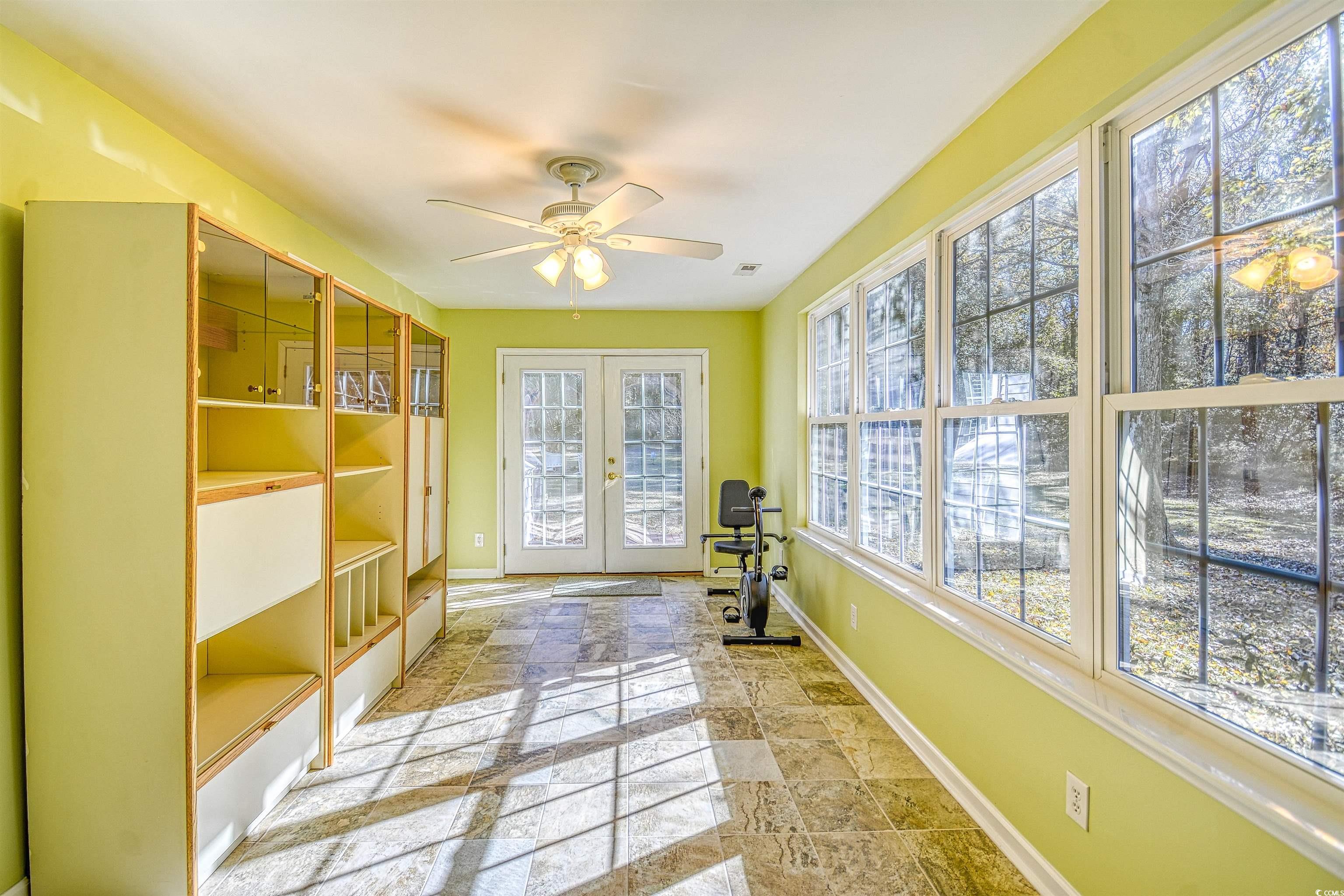 651 Bluebird Lane Murrells Inlet, SC 29576 - Photo 23 of 34 Doorway with ceiling fan, a wealth of natural ligh