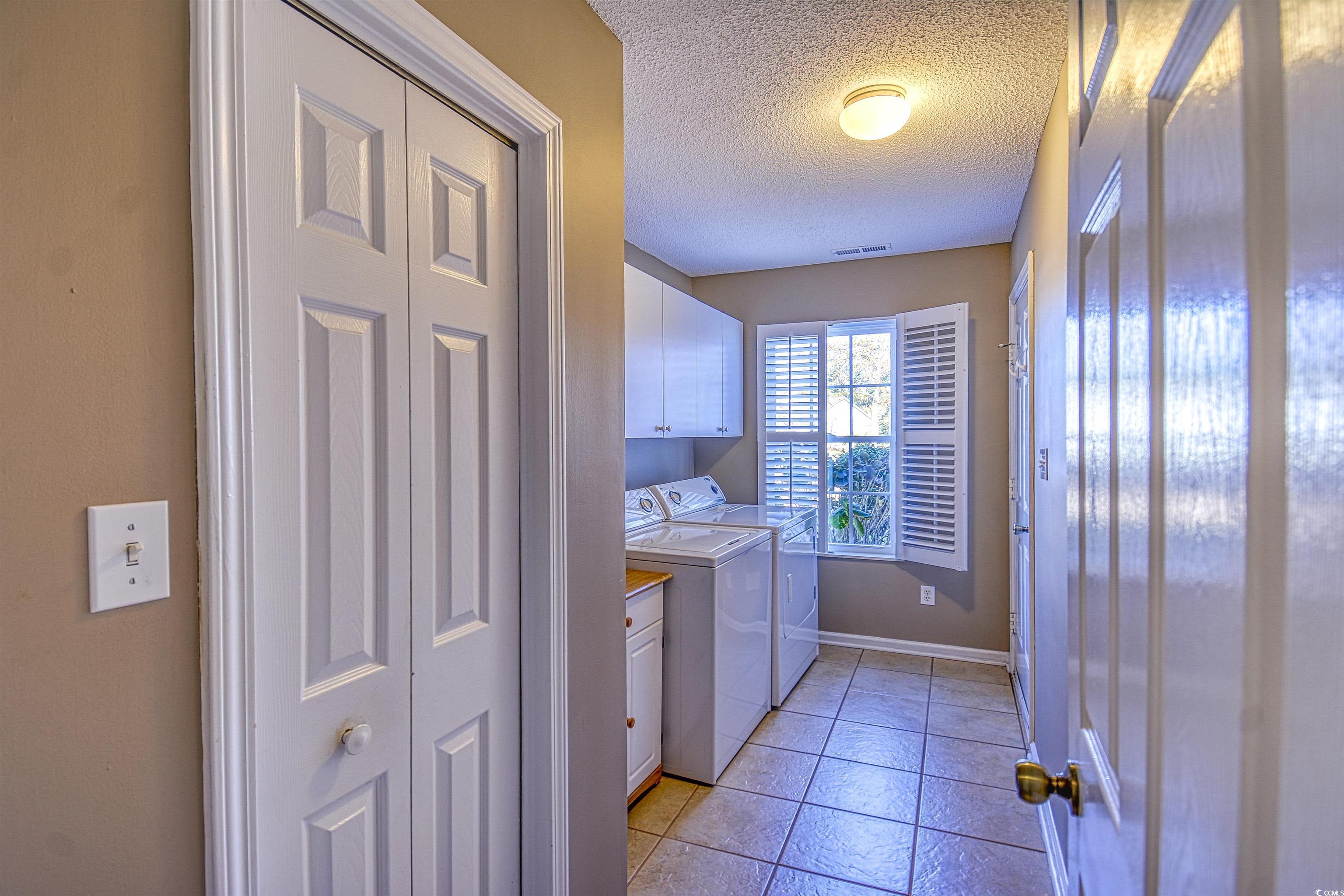 651 Bluebird Lane Murrells Inlet, SC 29576 - Photo 24 of 34 Laundry area with washer and clothes dryer, light