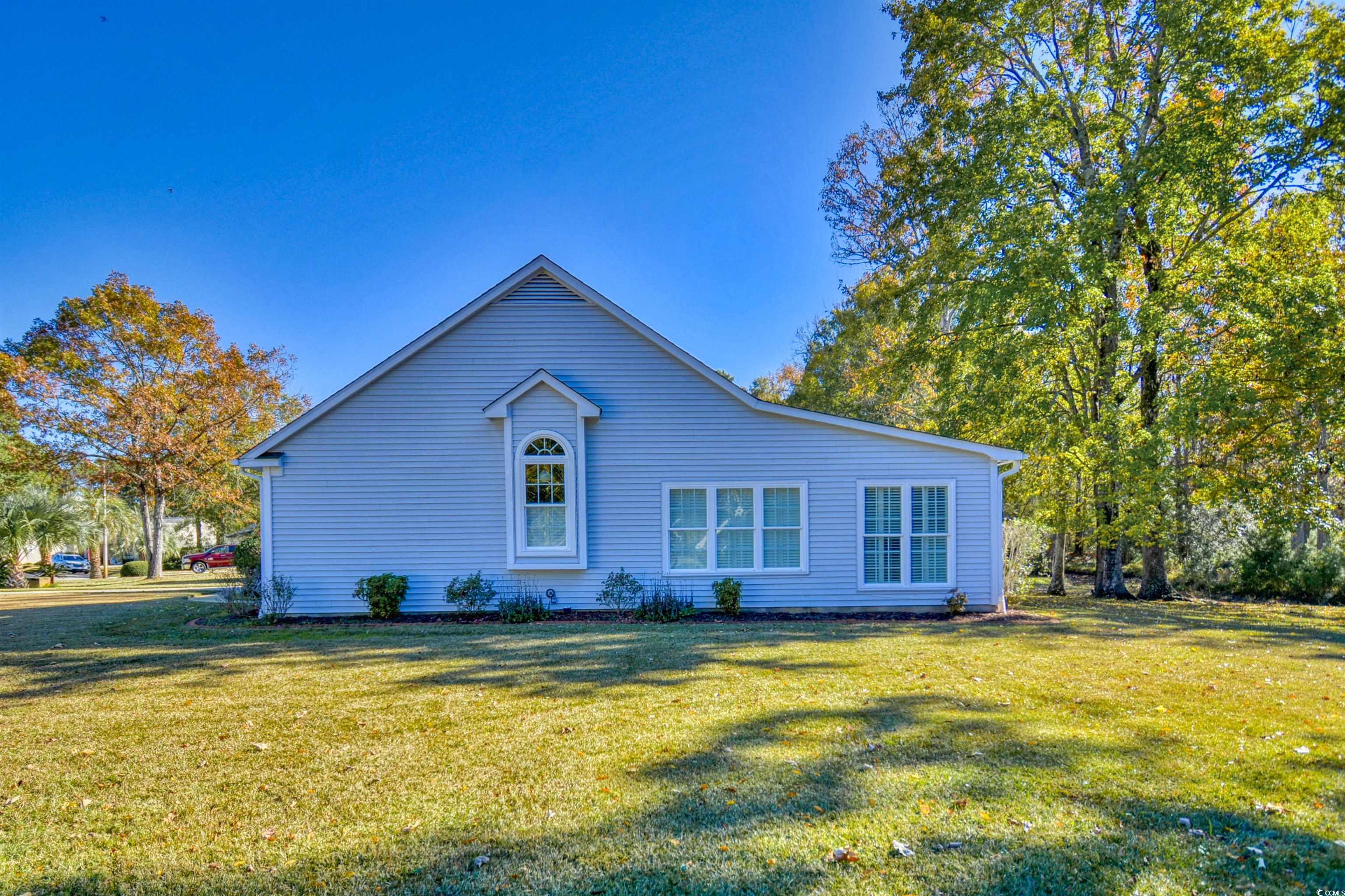 651 Bluebird Lane Murrells Inlet, SC 29576 - Photo 26 of 34 Ranch-style house featuring a front lawn