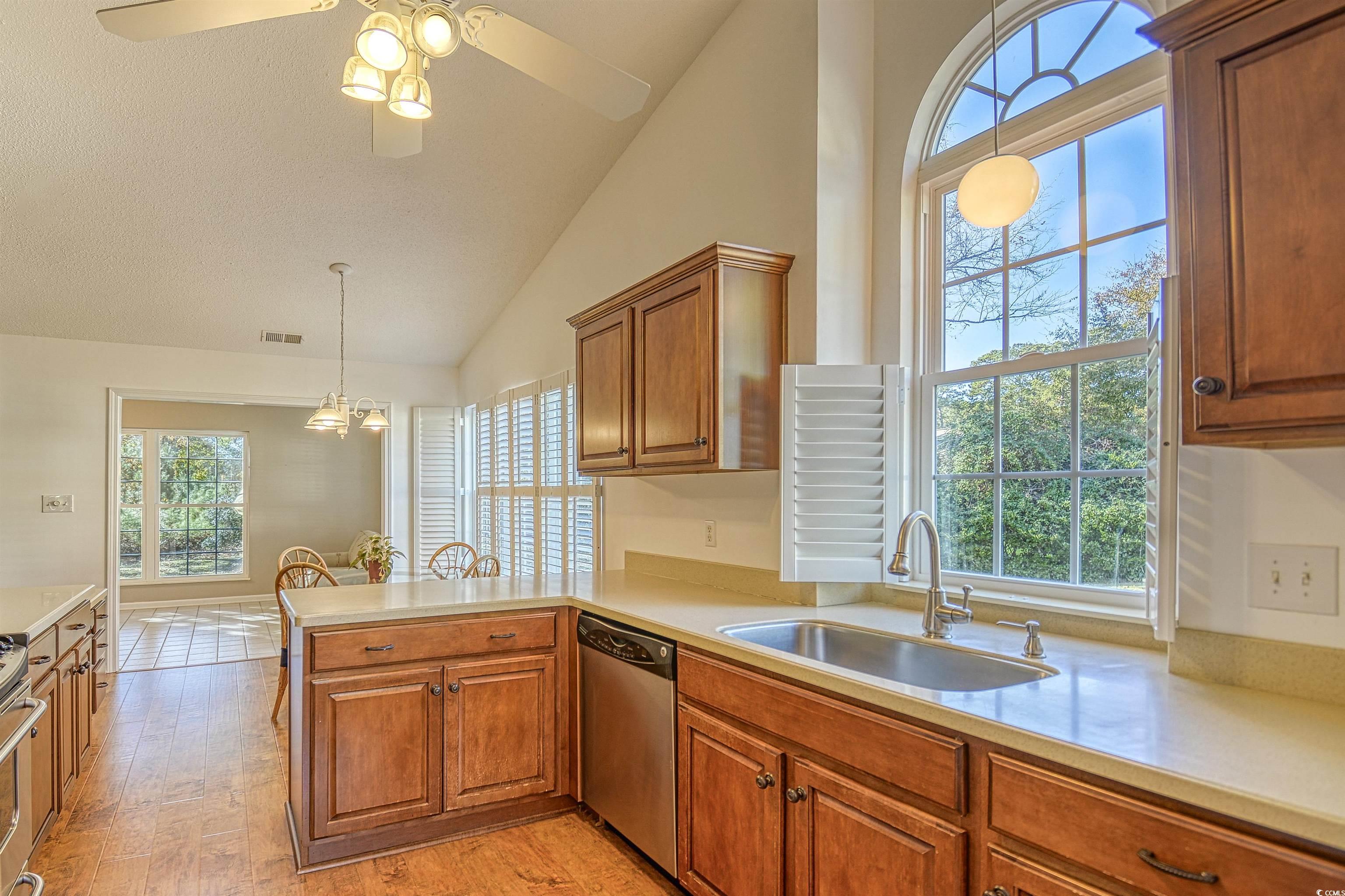 651 Bluebird Lane Murrells Inlet, SC 29576 - Photo 7 of 34 Kitchen featuring sink, light hardwood / wood-styl