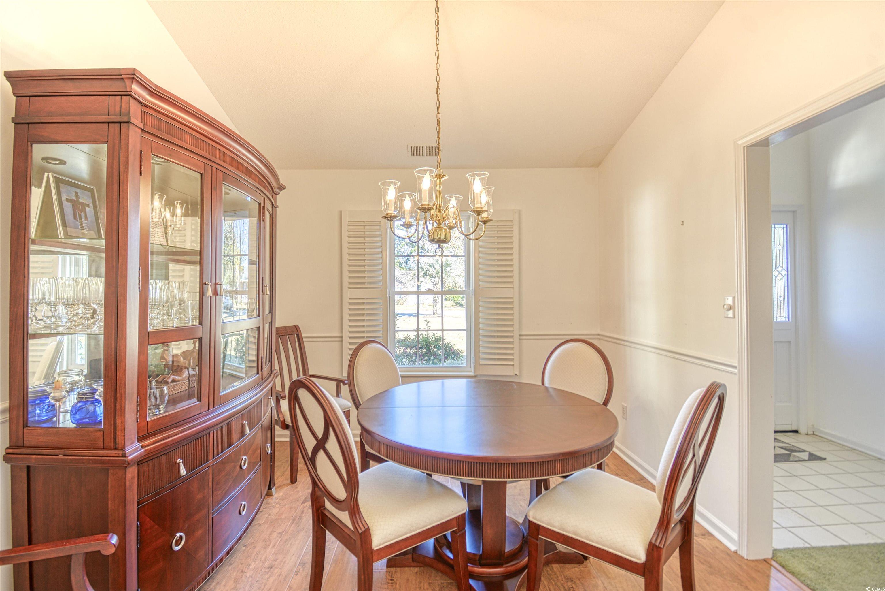 651 Bluebird Lane Murrells Inlet, SC 29576 - Photo 8 of 34 Dining area featuring light hardwood / wood-style