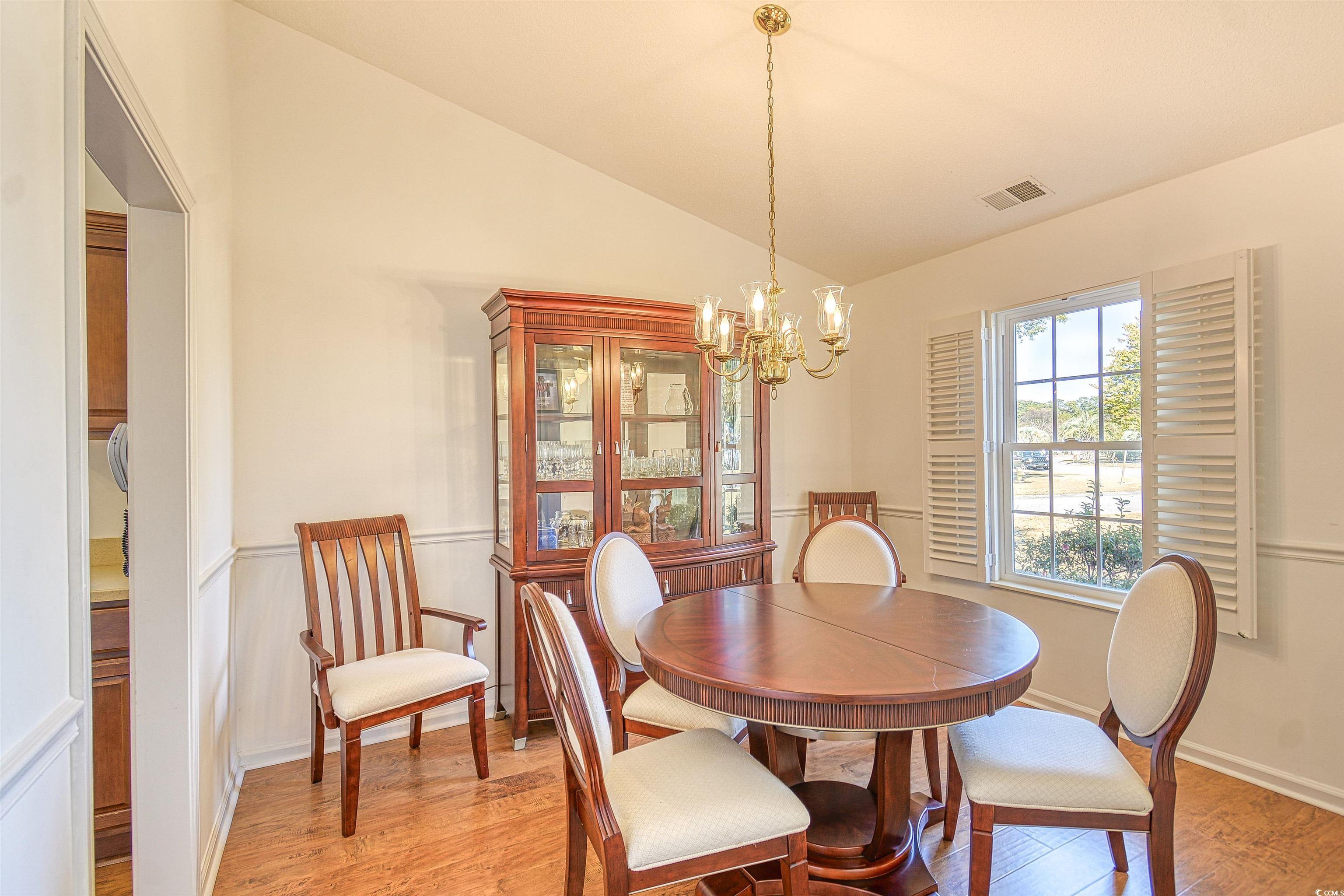 651 Bluebird Lane Murrells Inlet, SC 29576 - Photo 9 of 34 Dining area featuring light hardwood / wood-style