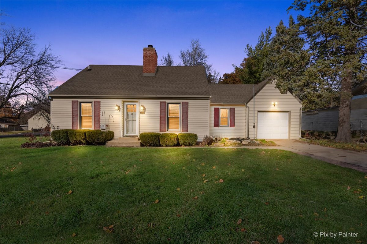 1106 West Highland Avenue Elgin, IL 60123 - Photo 1 of 47 a front view of a house with a yard