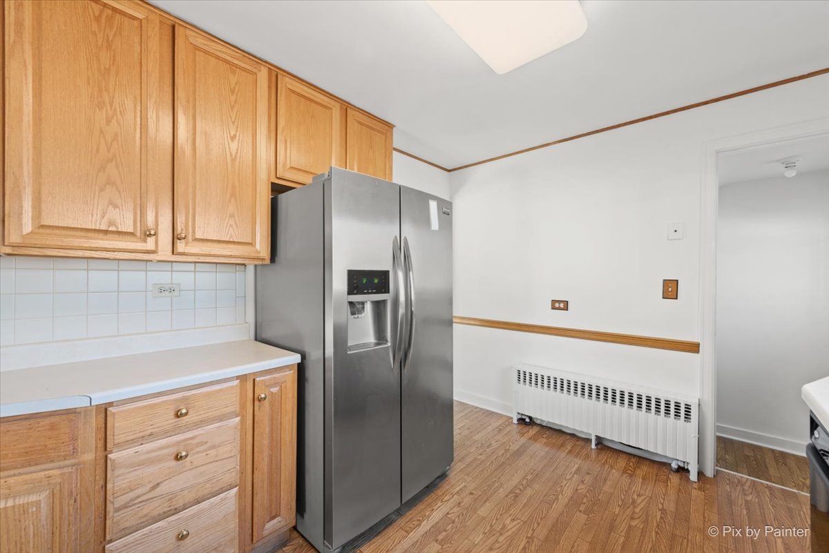 1106 West Highland Avenue Elgin, IL 60123 - Photo 12 of 47 a kitchen with stainless steel appliances granite countertop a refrigerator and a sink
