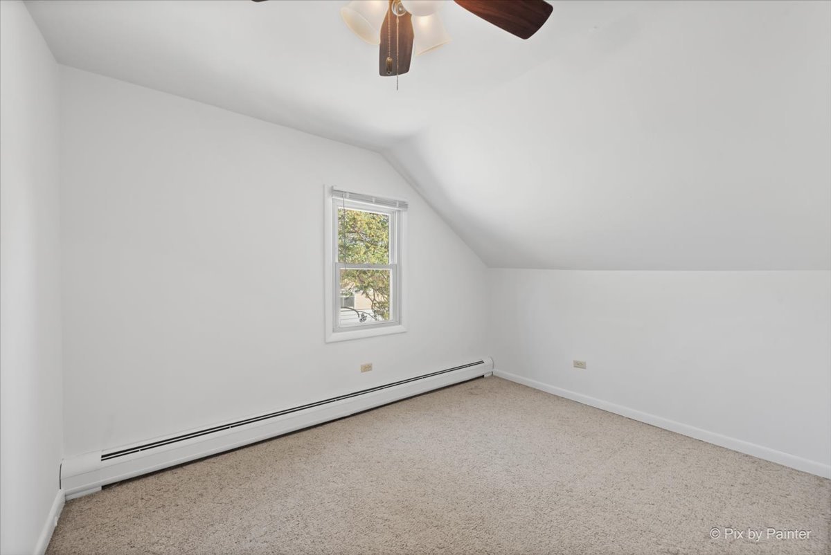 1106 West Highland Avenue Elgin, IL 60123 - Photo 23 of 47 an empty room with windows