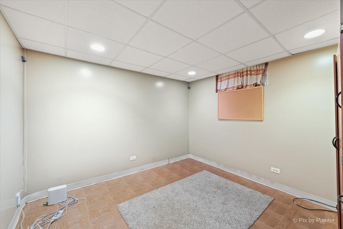 1106 West Highland Avenue Elgin, IL 60123 - Photo 29 of 47 an empty room with a workbench