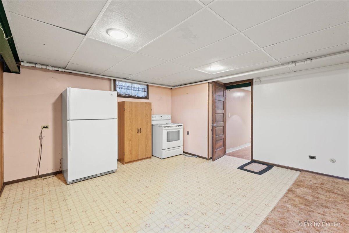 1106 West Highland Avenue Elgin, IL 60123 - Photo 32 of 47 a view of an empty room with a refrigerator