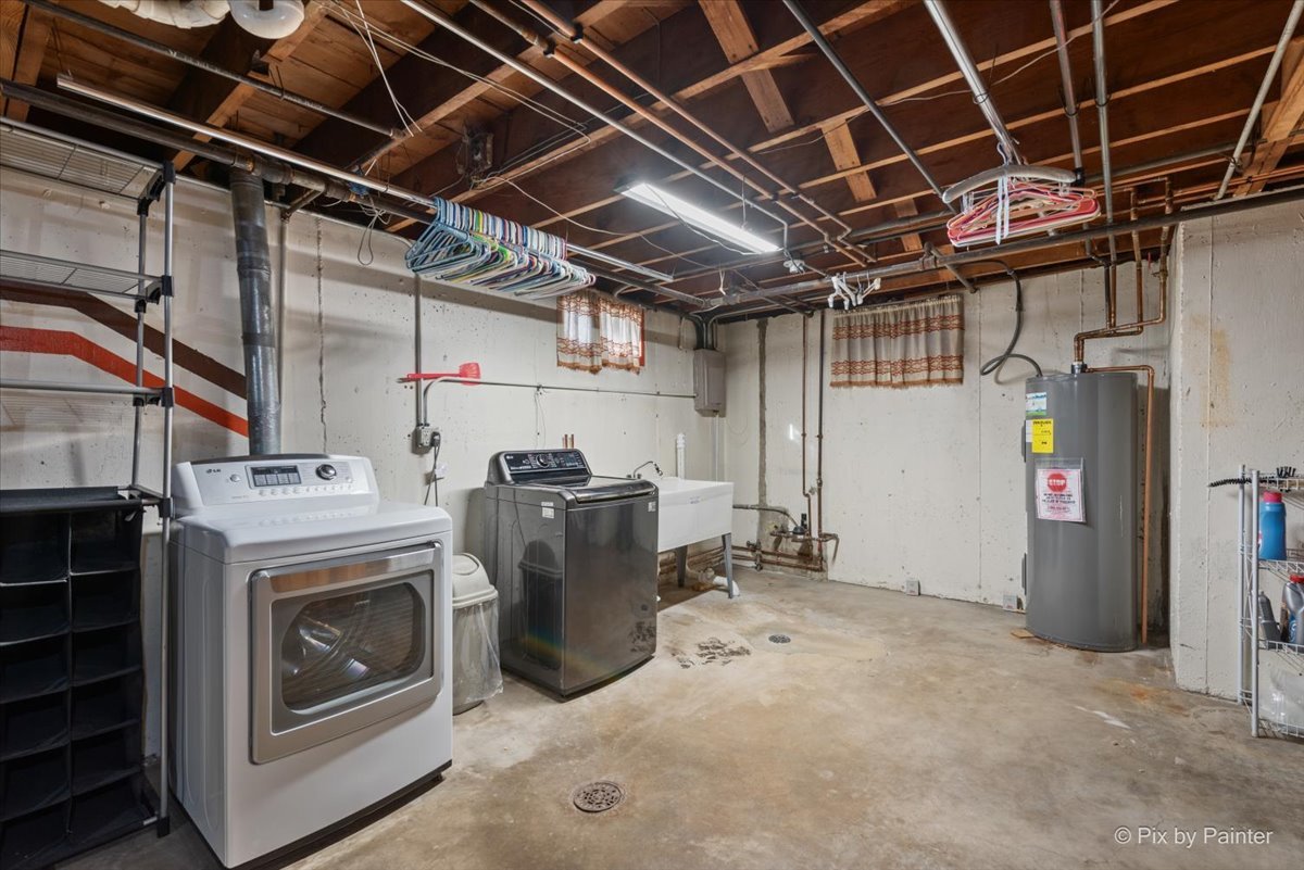 1106 West Highland Avenue Elgin, IL 60123 - Photo 33 of 47 a view of a storage & utility room with washer and dryer