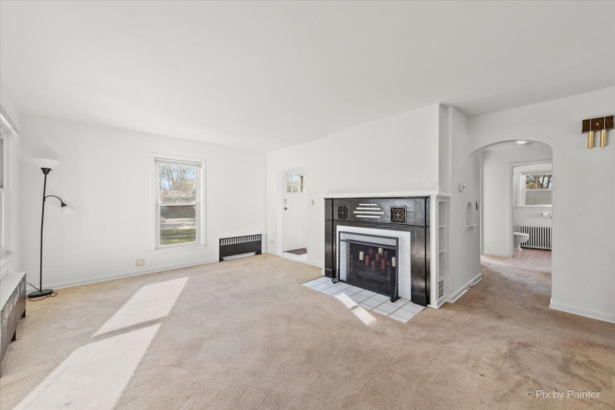 1106 West Highland Avenue Elgin, IL 60123 - Photo 8 of 47 a view of a livingroom with a fireplace