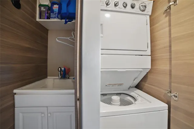 a bathroom with a sink and washing machine