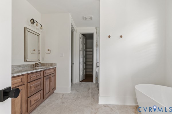 10512 River Road Chesterfield, VA 23838 - Photo 51 of 64 Freestanding soaking tub, wood-finish vanity with