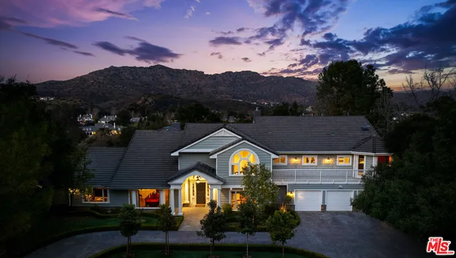 a view of multiple houses with a city street