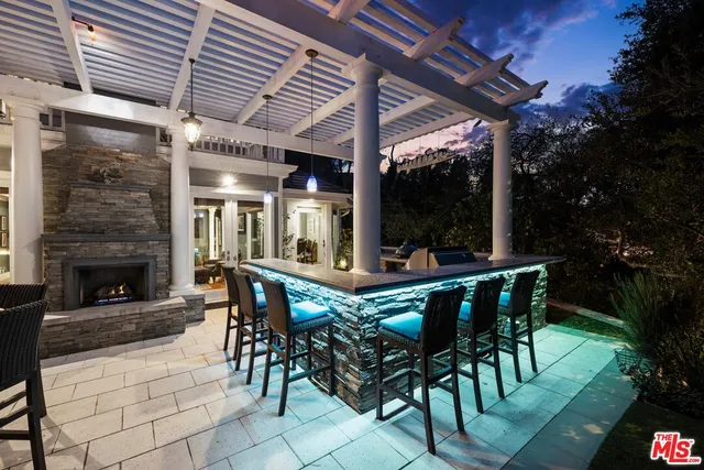 a swimming pool with outdoor seating and yard