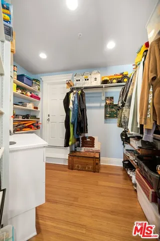 a bed room with furniture and a chandelier