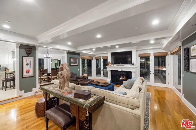 a living room with fireplace furniture and a flat screen tv