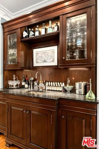 a room with a bed and a mirror