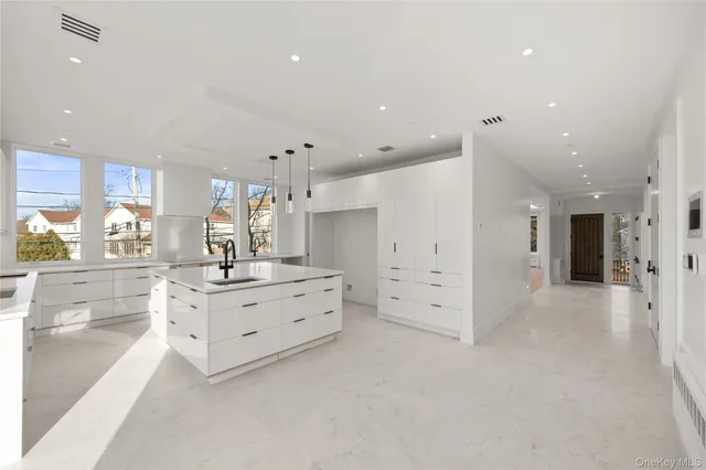 a kitchen with a sink cabinets and window