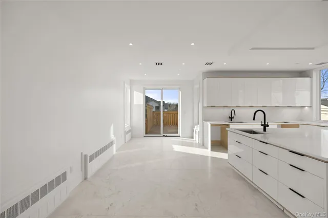 a kitchen with a sink and a stove