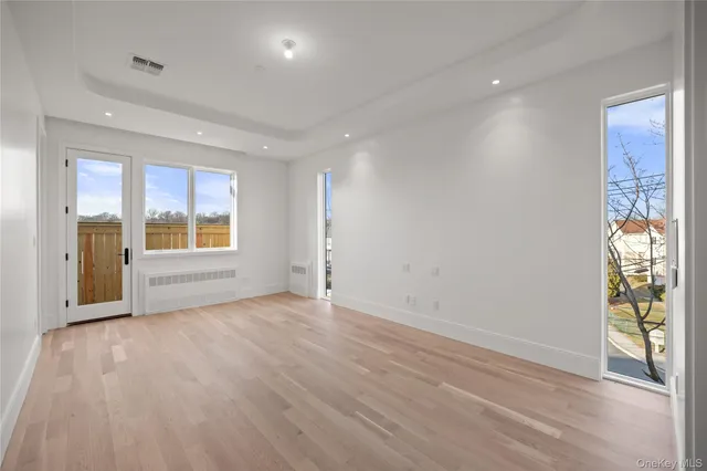 a view of walk in closet with empty racks