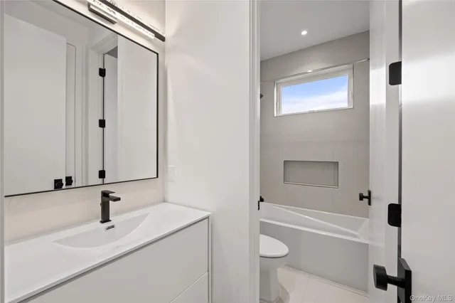 a bedroom with a bed and a view of bathroom