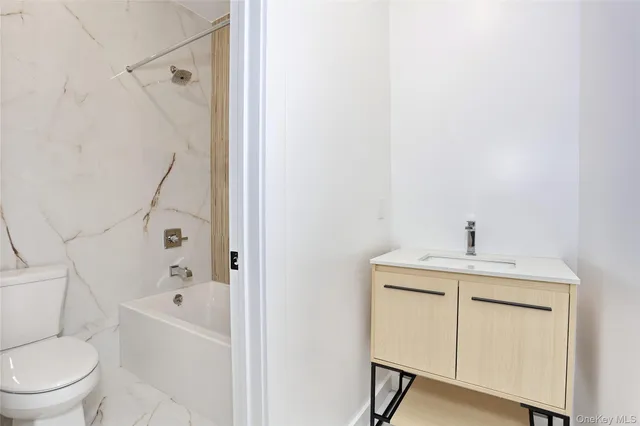 a view of an empty room with closet