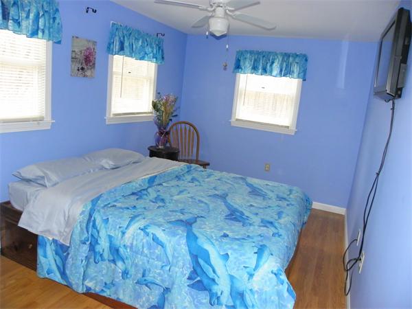 14 Shawnee Road Pepperell, MA 01463 - Photo 5 of 13 a bedroom with a bed and a window