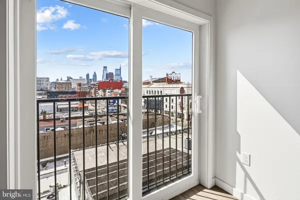 a view of a balcony from a floor to ceiling window