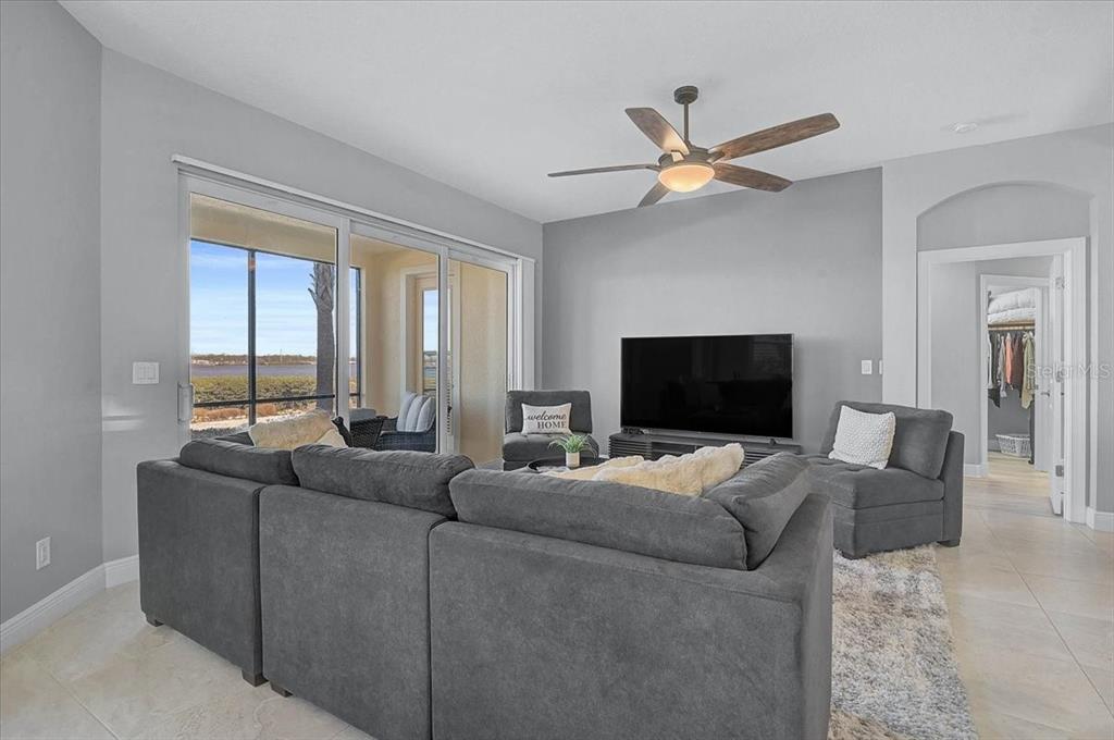 1258 Riverscape Street, Unit A Bradenton, FL 34208 - Photo 11 of 63 a living room with couches and a flat screen tv