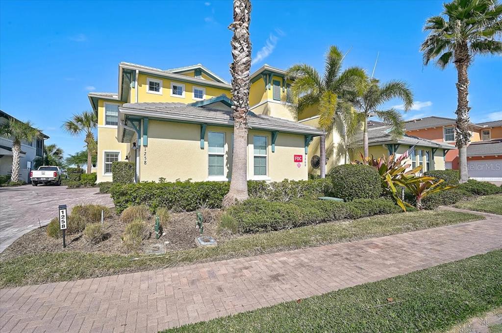 1258 Riverscape Street, Unit A Bradenton, FL 34208 - Photo 15 of 63 a front view of a house with a yard