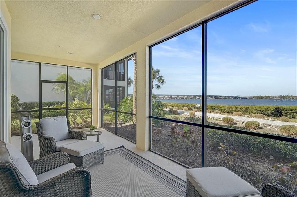 1258 Riverscape Street, Unit A Bradenton, FL 34208 - Photo 20 of 63 a living room with couch and a floor to ceiling window